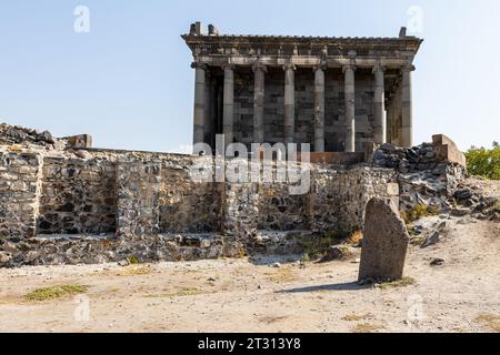 Garni, Armenia - September 30, 2023: ancient ruined royal buildings and Greco-Roman Temple of Garni on sunny day. It is the only monument surviving in Stock Photo