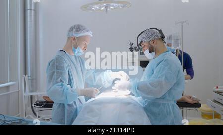 Medical team arranging surgical instruments in hospital operating room ...
