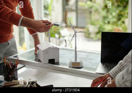 Team of engineers discussing new sustainable real estate project Stock Photo