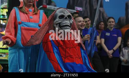 Serbia, Belgrade - June 20, 2023: Boy in suit with skull mask. Clip. Children's costume show with magic tricks and contests. Boy in skull mask at Stock Photo