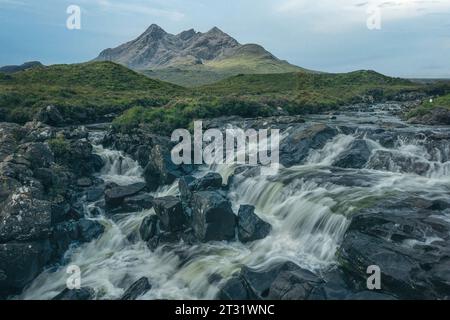 Sligachan Waterfalls are a series of waterfalls on the River Sligachan, cascading down the slopes of the Cuillin Mountains, Isle of Skye, Scotland. Stock Photo