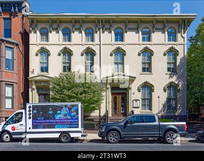 Downtown Trenton: A pair of attached townhouses with Italianate details on a stucco façade in State House Historic District. Stock Photo