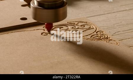 Drawings on wood. Creative. Sawing on a tree with a special cutter. Stock Photo
