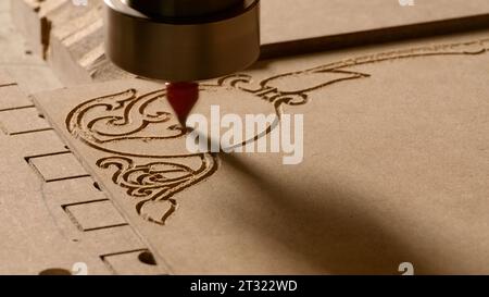 Drawings on wood. Creative. Sawing on a tree with a special cutter. Stock Photo