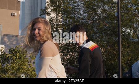 Energetic dancing. Stock. Two young people dance in summer weather against the backdrop of a megalopolis. Stock Photo