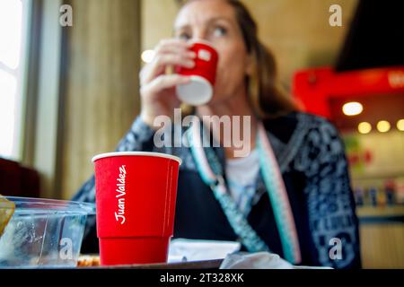 Bogota, Colombia - January 1, 2023: Woman drinks coffee in a Juan Valdez store, in the district of La Candelaria Stock Photo