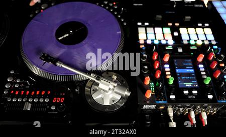 Berlin - Germany, december 6, 2022: Hands of soundman on the mixing console. Art. Working of sound designer. Stock Photo