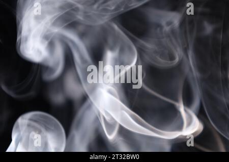White silver smoke on a dark background, colourful abstract, white fog, minimalistic background, detailed smoke shapes Stock Photo