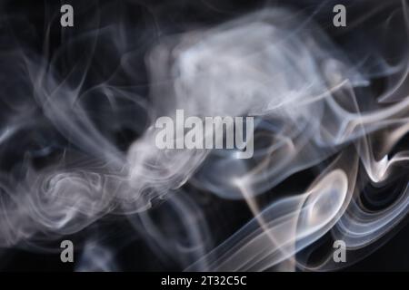 White silver smoke on a dark background, colourful abstract, white fog, minimalistic background, detailed smoke shapes Stock Photo