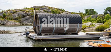 Gothenburg, Sweden - July 24 2022: Barrel shaped sauna on a raft Stock Photo