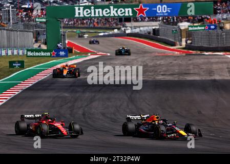 Austin, USA. 22nd Oct, 2023. Carlos Sainz Jr (ESP) Ferrari SF-23 and Max Verstappen (NLD) Red Bull Racing RB19 battle for position. Formula 1 World Championship, Rd 19, United States Grand Prix, Sunday 22nd October 2023. Circuit of the Americas, Austin, Texas, USA. Credit: James Moy/Alamy Live News Stock Photo