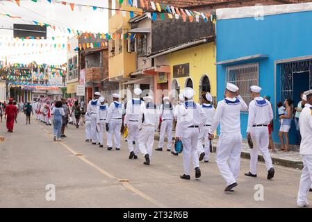 Saubara, Bahia, Brazil - August 06, 2022: Men from a Marujada, dressed as sailors, are seen parading through the streets of the city of Saubara, in Ba Stock Photo