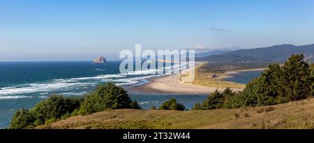 Scenic view from Porter Point with the confluence of  Nestucca River and the Pacific Ocean, Haystack Rock, and Cape Kiwanda State Natural Area Stock Photo