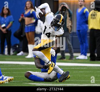 Inglewood, United States. 22nd Oct, 2023. Pittsburgh Steelers wide receiver George Pickens (14) eludes the tackle of Los Angeles Rams safety Russ Yeast during fourth quarter action at SoFi Stadium in Inglewood, California Sunday, October 22, 2023. The Steelers be a the Rams 24-17. Photo by Jon SooHoo/UPI Credit: UPI/Alamy Live News Stock Photo