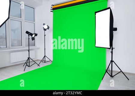 Chroma key compositing. Green backdrop and equipment in studio Stock Photo