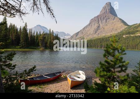 View of Mount Grinnell through wildfire smoke over Swiftcurrent Lake in Glacier National Park, Montana. Stock Photo