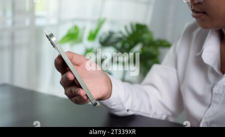 Asian woman holding a smartphone showing communication technology concept Stock Photo