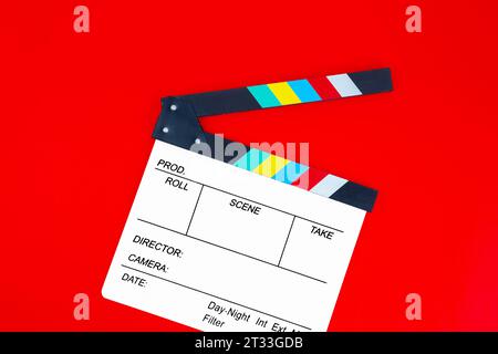 Blank film slate isolated on red color background. Stock Photo