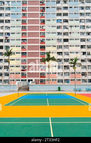Choi Hung Estate rainbow apartment building and colorful basketball court in Hong Kong Stock Photo