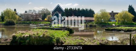 BATTLESBRIDGE, ESSEX, UK - APRIL 10, 2010:  Panorama view of the Old Tide Mill and Gates on the River Crouch Stock Photo