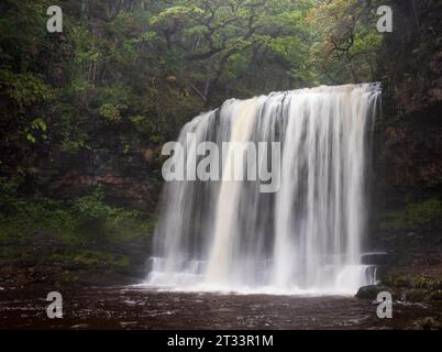 Waterfall Sgwd yr Eira on the four waterfalls walk in Brecon Beacons national park Wales UK Stock Photo