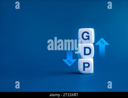 GDP business concept. Word "GDP" Gross domestic product on white cube block stack near up and down arrows with percentage icon. Business growth and me Stock Photo