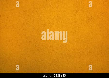 Yellow background, texture of old building exterior wall, vibrant color Stock Photo