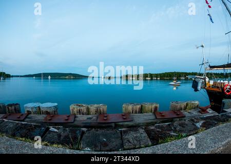 Lakeview with a fisheye and a lighthouse in the background Stock Photo