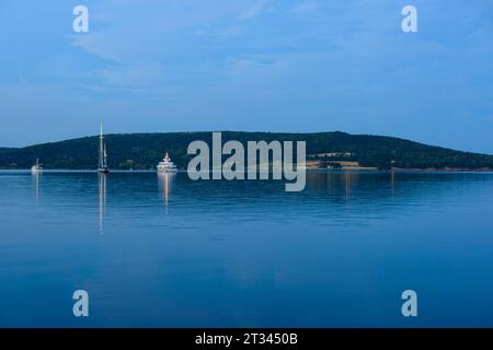 Lake with boats in the evening Stock Photo