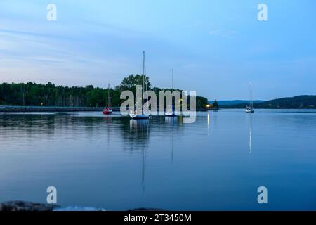 Lake with boats in the evening Stock Photo