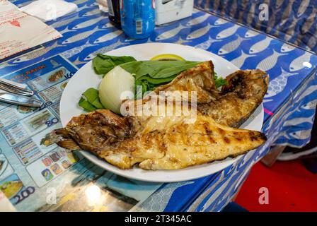 Istanbul, Turkey, Grilled mackerel on a table. Stock Photo