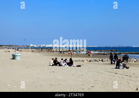 Walks and beach activities in spring on Grand Traverse beach. Mauguio Carnon, Occitanie, France Stock Photo