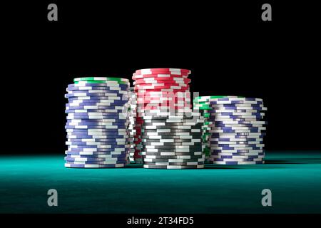 Casino chips forming multiple stacks. Placing bets and winning a fortune. Good luck, jackpot. Fine checks piled up together on a gaming table. The Las Stock Photo