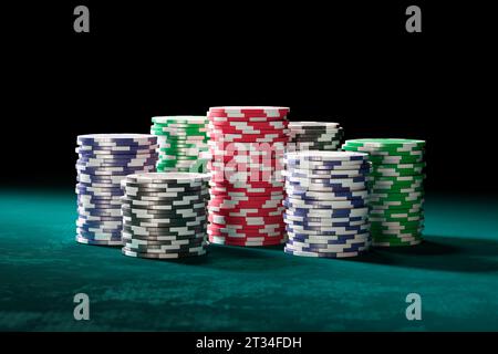 Casino chips forming multiple stacks. Placing bets and winning a fortune. Good luck, jackpot. Fine checks piled up together on a gaming table. The Las Stock Photo
