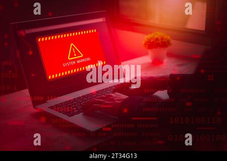 Alert system warning hacked on laptop. Cyber attack on computer network, Virus, Spyware, Malware or Malicious software. Cyber security and cybercrime. Stock Photo
