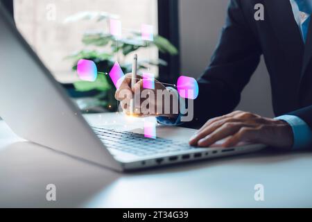 Businessman using computer office analysis for process workflows or flowcharts. Implement and improve automation. Managing organization hierarchical p Stock Photo