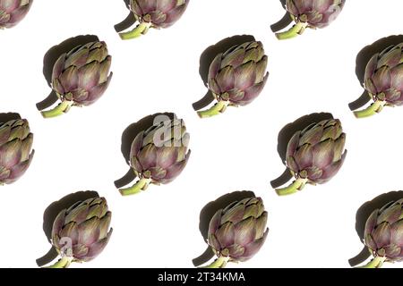 Pattern from green artichokes on white  background. Creative food poster template for wallpaper Stock Photo