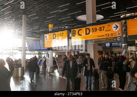 Amsterdam, The Netherlands - October 22, 2023: People at the Amsterdam Schiphol airport. Stock Photo