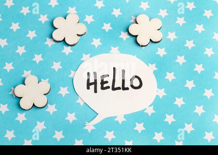 Hello speech bublle on a light blue background with white stars Stock Photo