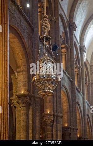 SANTIAGO DE COMPOSTELLA, October 5, 2023 : Arches and Botafumeiro dispensing clouds of incense in Santiago de Compostela Basilica, during the Pilgrim' Stock Photo