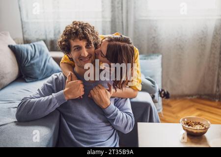 Portrait of young happy couple at home. Stock Photo