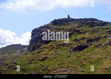 The Trig Point & Crags on the Summit of the Wainwright on Place Fell from Hart Crag, Lake District National Park, Cumbria, England, UK. Stock Photo