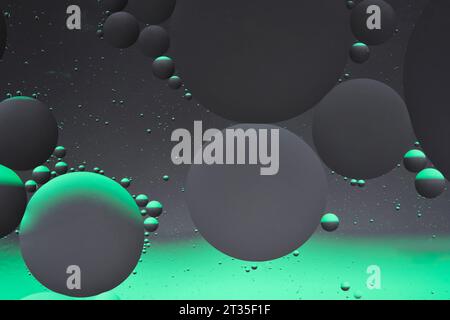 Abstract dark gray green background with oil circles water surface Stock Photo