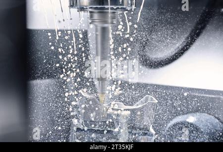 Macro shot of CNC machine cutting metal Stock Photo