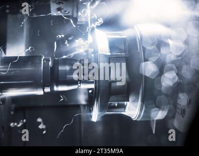 Macro shot of automated CNC Machine cutting metal Stock Photo