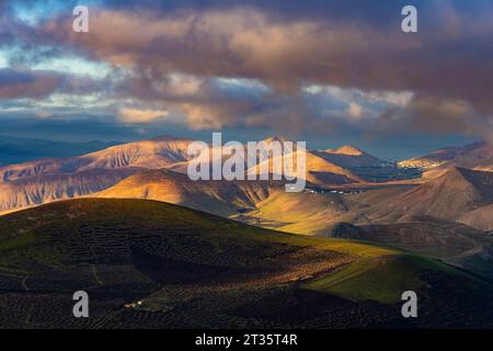 Spain, Canary Islands, La Geria, Clouds over Los Ajaches formation at cloudy dawn Stock Photo