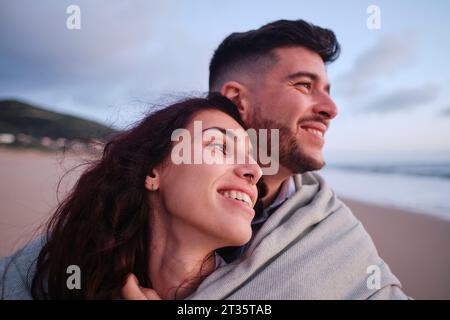 Happy young couple spending leisure time at beach Stock Photo