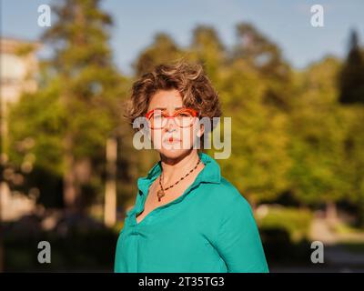 Mature woman wearing eyeglasses at sunny day Stock Photo