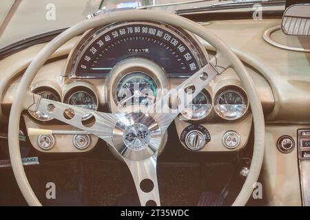 Essen, Germany - March 23, 2022: Retro styled image of a dashboard of a 1961 Chevrolet Corvette C1 Fuel Injection convertible car in Essen, Germany Stock Photo
