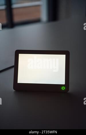 Tablet PC with blank screen at desk in office Stock Photo